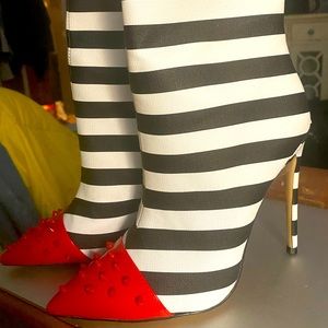 Black and White with red studded toe boots.